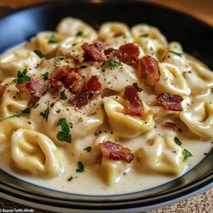 Craving comfort food? Discover the ultimate Bacon Tortellini Alfredo recipe! This easy pasta dish is rich, creamy, & packed with flavor. Quick weeknight dinner solution? Discover easy tips for perfection. Learn, Try!
