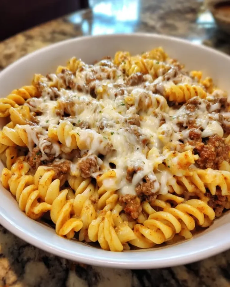 Craving comfort food? Make quick, easy Beefy Parmesan Rotini with Garlic Cheese Sauce in just 2 steps! Learn the recipe now.