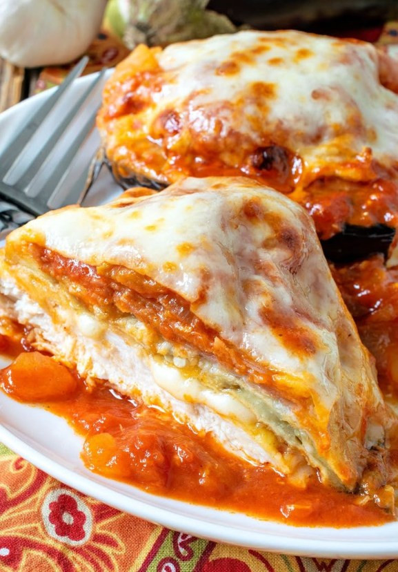Restaurant style? Best Chicken Sorrentino with Marsala Tomato Sauce layers eggplant and prosciutto—Discover.
