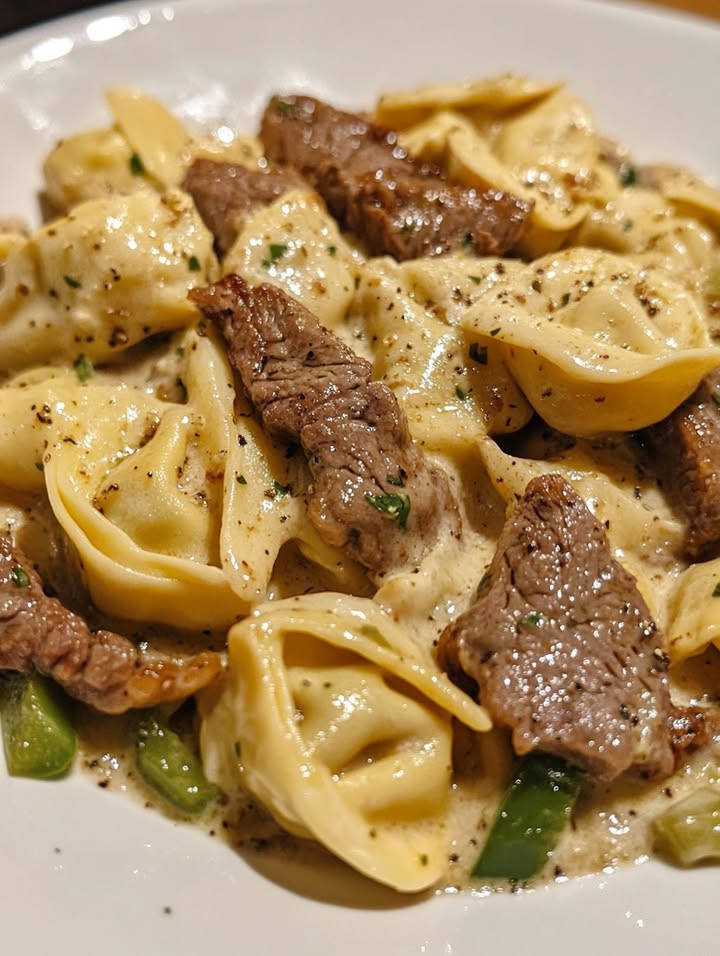 Craving Easy Philly-Style Steak Tortellini with Provolone Sauce with easy steps and flavor tips Discover