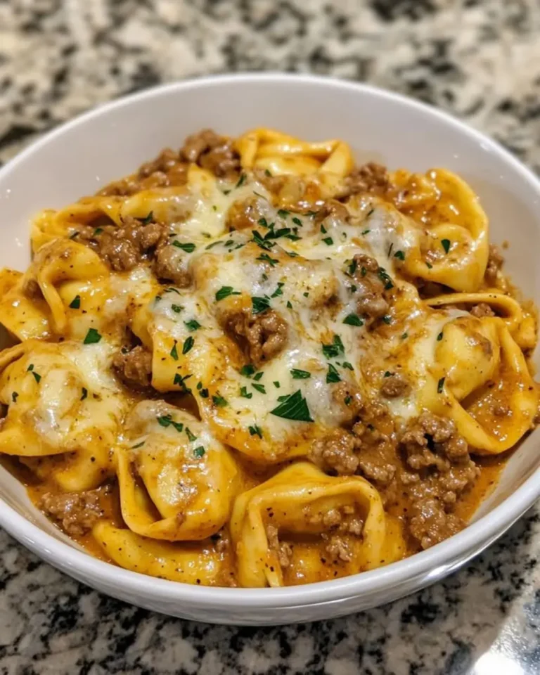 Craving comfort food fast? This Spicy Cheesy Tortellini Skillet with Beef recipe is ready in 5 easy steps! Try it now!